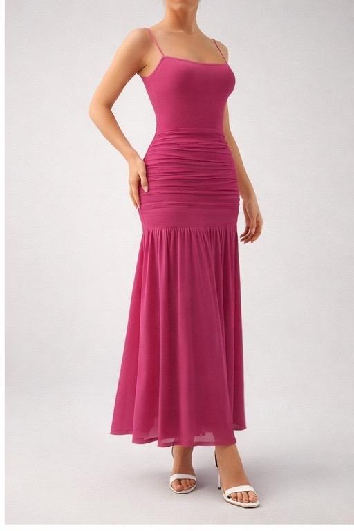 Deep rose Atelier dress by LOROMIA, featuring flowing fabric and elegant design, displayed on a hanger.