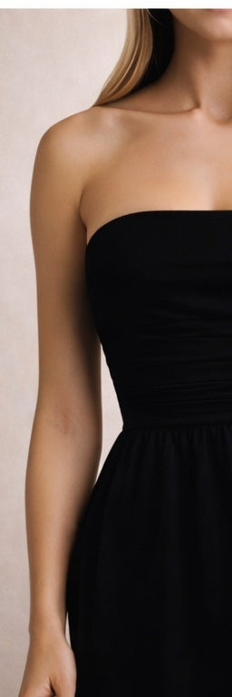 Black Noir Muse dress by Trendsi featuring a fitted silhouette, elegant neckline, and stylish design perfect for evening wear.